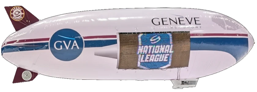 Real photograph of our physical RC blimp flying an LED display banner